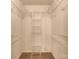 Spacious walk in closet with shelving and neutral carpet at 2011 20Th Street Ne Pl, Hickory, NC 28601