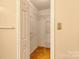 Bedroom closet includes shelving, carpet, and neutral paint at 2011 20Th Street Ne Pl, Hickory, NC 28601