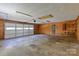 Spacious two car garage with high ceilings, garage door with windows, and fluorescent lighting at 2011 20Th Street Ne Pl, Hickory, NC 28601