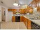 Kitchen with wooden cabinets, brick style backsplash, and modern appliances at 2011 20Th Street Ne Pl, Hickory, NC 28601