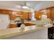 Kitchen with wooden cabinets, brick style backsplash, and modern appliances at 2011 20Th Street Ne Pl, Hickory, NC 28601