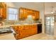 Kitchen with wooden cabinets, brick style backsplash, and modern appliances at 2011 20Th Street Ne Pl, Hickory, NC 28601