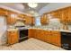 Kitchen with wooden cabinets, brick style backsplash, and modern appliances at 2011 20Th Street Ne Pl, Hickory, NC 28601