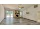 Bright living room featuring stone fireplace, sliding glass doors to a deck, and light gray flooring at 2011 20Th Street Ne Pl, Hickory, NC 28601