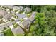 Aerial view of a neighborhood showcasing well-maintained homes, tree-lined streets, and lush greenery at 20307 Creek Bend Edge Ct # 10, Matthews, NC 28105