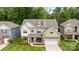 Lovely two-story home features a manicured lawn, a cozy porch, and an attached two-car garage at 20307 Creek Bend Edge Ct # 10, Matthews, NC 28105