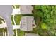 Aerial view showcases a home's roof, backyard with playground, and proximity to neighboring homes and streets at 20307 Creek Bend Edge Ct # 10, Matthews, NC 28105