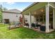 Charming backyard features a covered patio with playground, perfect for outdoor living at 20307 Creek Bend Edge Ct # 10, Matthews, NC 28105