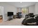 Bedroom with carpet, multiple desks, and view of neighborhood from the window at 20307 Creek Bend Edge Ct # 10, Matthews, NC 28105