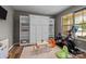 Versatile room featuring a built-in Murphy bed and shelving, ideal for a guest room or home office at 20307 Creek Bend Edge Ct # 10, Matthews, NC 28105