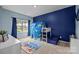 bedroom with a carpeted floor, blue walls, and a playful ocean theme at 20307 Creek Bend Edge Ct # 10, Matthews, NC 28105