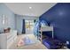 bedroom with blue accent wall, and built-in bunkbeds with a playful ocean theme at 20307 Creek Bend Edge Ct # 10, Matthews, NC 28105