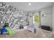 Bright bedroom with a playful wall design, perfect for a imaginative space at 20307 Creek Bend Edge Ct # 10, Matthews, NC 28105