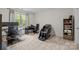 Bedroom with a work area, massage chair, carpeted floor, and a window view at 20307 Creek Bend Edge Ct # 10, Matthews, NC 28105