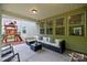 Relaxing covered patio offers cozy seating, a black wicker table, and a view of the play area at 20307 Creek Bend Edge Ct # 10, Matthews, NC 28105