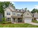 Charming two-story home boasts a welcoming front porch, manicured landscaping, and a two-car garage at 20307 Creek Bend Edge Ct # 10, Matthews, NC 28105