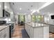 Modern kitchen overlooking living space, featuring granite counters and stainless steel appliances at 20307 Creek Bend Edge Ct # 10, Matthews, NC 28105
