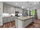 Well-lit kitchen boasting granite counters, stainless appliances, and modern pendant lighting at 20307 Creek Bend Edge Ct # 10, Matthews, NC 28105