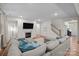 Spacious living room with a fireplace, large windows, hardwood floors, and a comfortable sectional sofa at 20307 Creek Bend Edge Ct # 10, Matthews, NC 28105