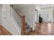 Entry way with wooden staircase, neutral walls, and wood-look flooring at 20307 Creek Bend Edge Ct # 10, Matthews, NC 28105
