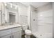 Bathroom featuring a shower, granite vanity, and a clean, modern design at 209 S Gregory St # 3, Lancaster, SC 29720