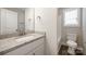 The modern bathroom contains a granite vanity and shower at 209 S Gregory St # 3, Lancaster, SC 29720