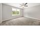 Bedroom featuring neutral carpet, ceiling fan, and natural light at 209 S Gregory St # 3, Lancaster, SC 29720