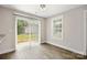 Bright dining area with hardwood floors and sliding glass doors that lead to the backyard at 209 S Gregory St # 3, Lancaster, SC 29720