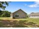 Side and rear home exterior showcasing ample yard and convenient window placement at 209 S Gregory St # 3, Lancaster, SC 29720