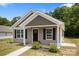Charming home featuring a well-manicured front yard with lush landscaping at 209 S Gregory St # 3, Lancaster, SC 29720