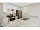 Bright kitchen featuring granite countertops, stainless steel appliances, and white cabinets at 209 S Gregory St # 3, Lancaster, SC 29720