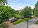Street view shows manicured landscaping in front of the community with mature trees at 212 W 10Th St # 3, Charlotte, NC 28202