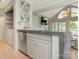 Kitchen area featuring bar seating, stainless steel appliances, stone countertops and outdoor views at 212 W 10Th St # 3, Charlotte, NC 28202