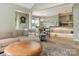 Bright open-concept living room flowing into the dining area and featuring modern decor and hardwood floors at 212 W 10Th St # 3, Charlotte, NC 28202