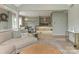 Open-concept living room featuring fireplace, open kitchen and dining area, and hardwood floors at 212 W 10Th St # 3, Charlotte, NC 28202