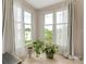 Bright room with windows, lots of natural light, hardwood floors, and houseplants at 212 W 10Th St # 3, Charlotte, NC 28202
