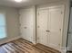 Spacious bedroom with two large closets, wood flooring, and ample storage at 216 N Vance St, Gastonia, NC 28052