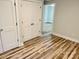 Neutral bedroom with storage closets and new wood flooring at 216 N Vance St, Gastonia, NC 28052