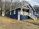 Newly renovated craftsman bungalow with navy siding, white trim and a bright yellow front door at 216 N Vance St, Gastonia, NC 28052