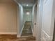 Hallway showcasing new wood flooring, fresh paint, and ample lighting at 216 N Vance St, Gastonia, NC 28052
