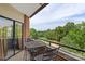 Balcony featuring outdoor seating and views of a park at 224 N Poplar St # 24, Charlotte, NC 28202