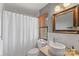 Bright bathroom features a shower with tub, modern fixtures, and decorative mirror at 224 N Poplar St # 24, Charlotte, NC 28202