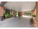 Spacious carport area with well-maintained landscaping around brick pillars at 224 N Poplar St # 24, Charlotte, NC 28202