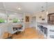 Bright dining room open to the living room and kitchen with hardwood floors at 224 N Poplar St # 24, Charlotte, NC 28202