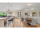 Open concept dining and living room with hardwood floors and neutral paint at 224 N Poplar St # 24, Charlotte, NC 28202