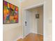 Bright entryway with hardwood floors, white door, and neutral paint at 224 N Poplar St # 24, Charlotte, NC 28202