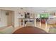 Open living and dining area with hardwood floors, bar seating, and ample natural light at 224 N Poplar St # 24, Charlotte, NC 28202