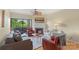 Cozy living room features a fireplace, plush seating, and access to a balcony at 224 N Poplar St # 24, Charlotte, NC 28202