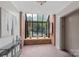 Inviting building entrance area featuring an indoor window garden and elevator access at 224 N Poplar St # 24, Charlotte, NC 28202