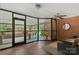 Bright building entry hall featuring glass doors, seating and brick flooring at 224 N Poplar St # 24, Charlotte, NC 28202